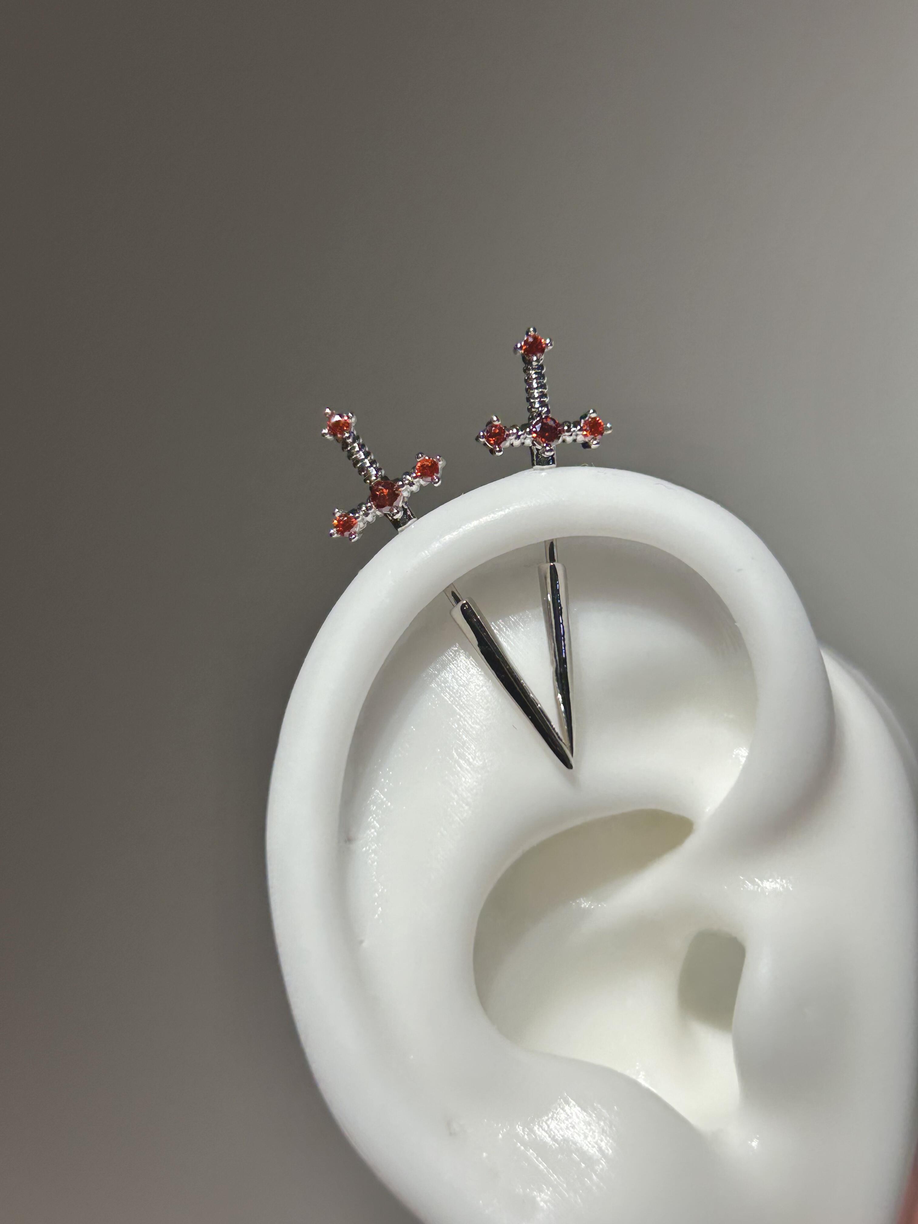 Red sword vertical helix earrings