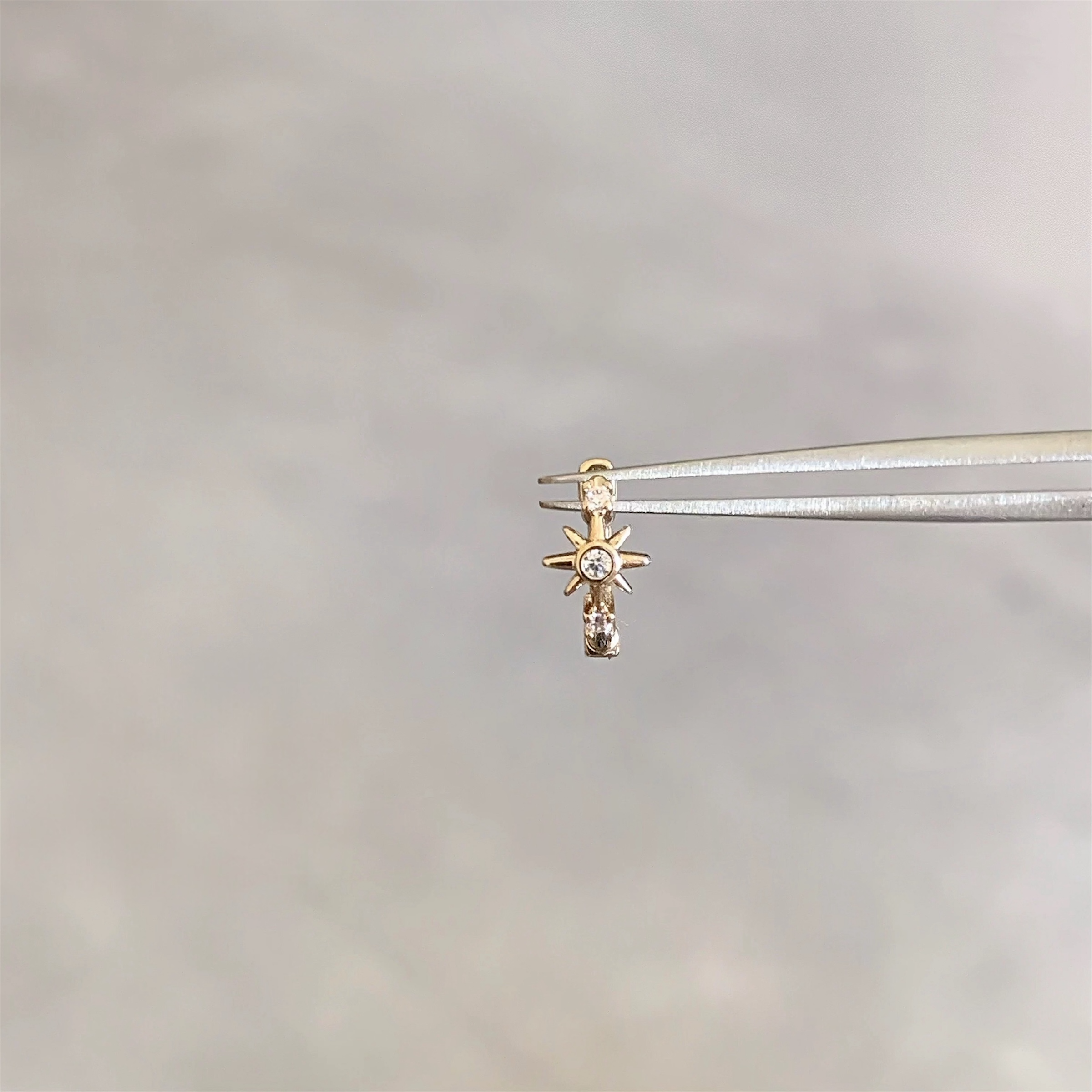 Gold Shining Star Helix Piercing